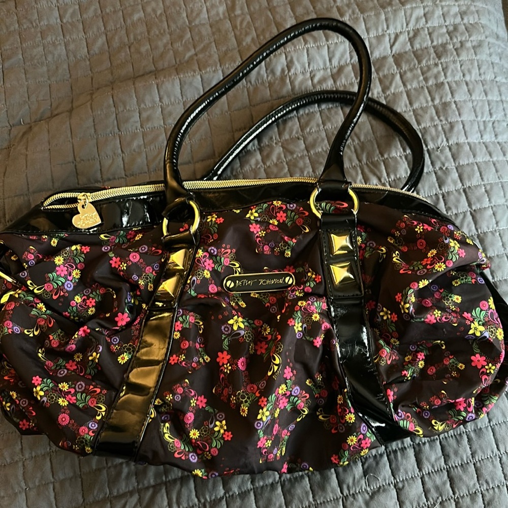 Betsey Johnson floral handbag. Black with multicolored wildflowers